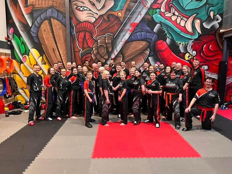 Students and coaches group photo at Astons Kickboxing Academy, Shrewsbury