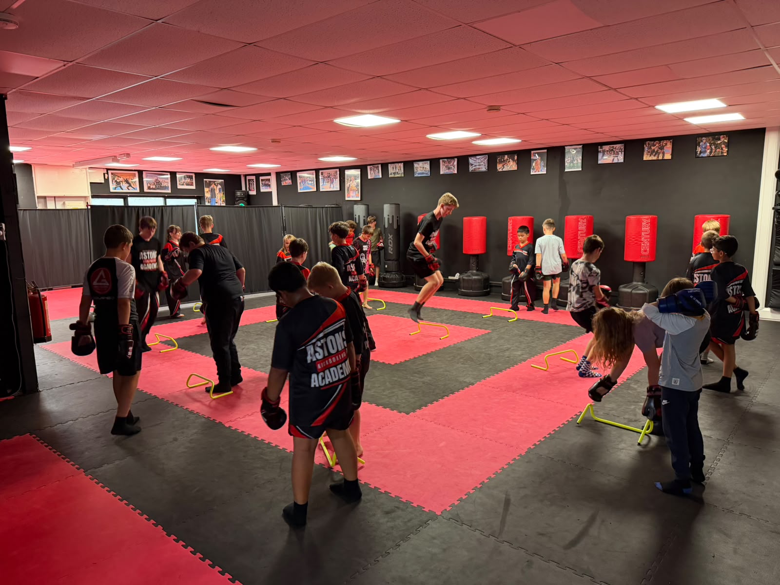 Kids kickboxing class doing agility hurdle drills at Astons Kickboxing Academy, Shrewsbury